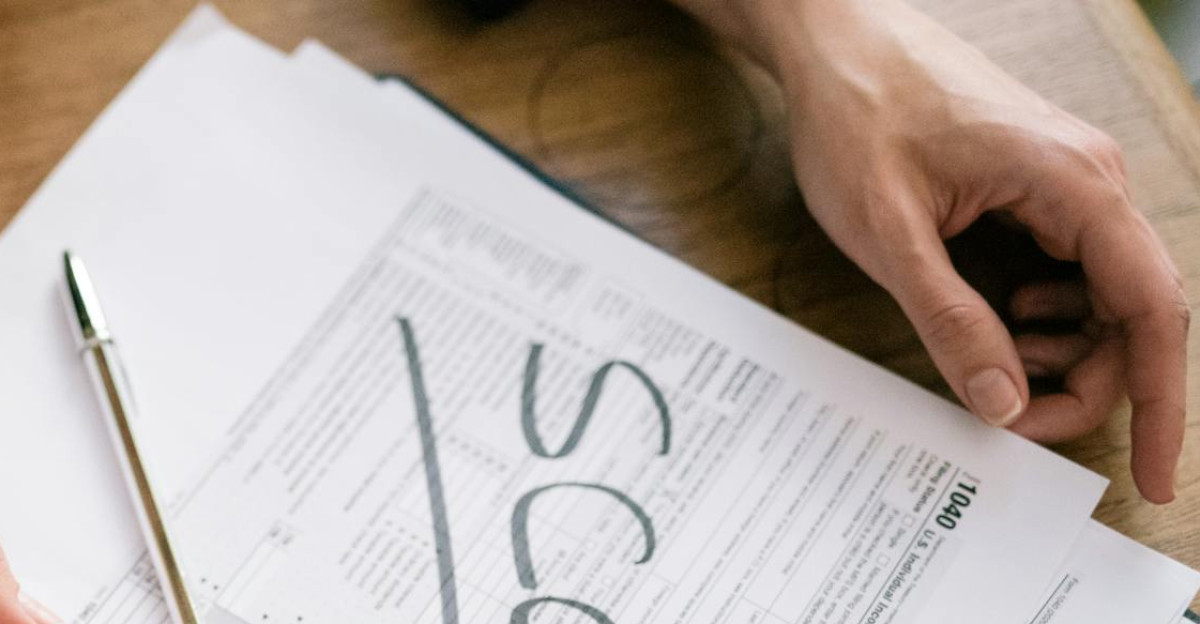 A close look at tax forms marked with scam highlighting financial fraud risks