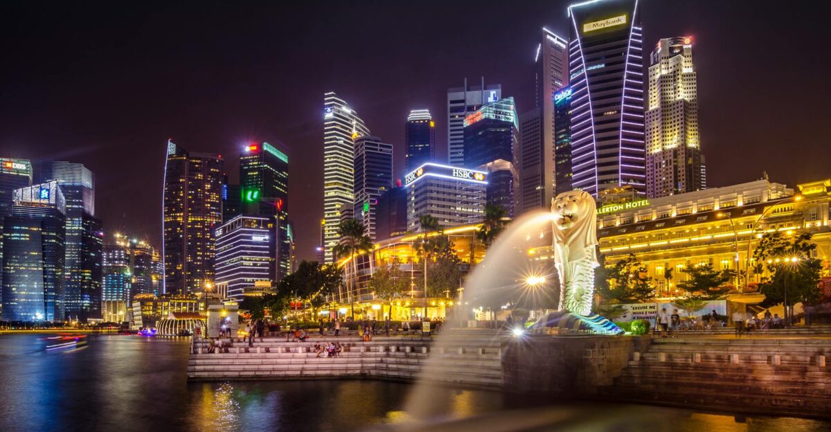 Dazzling view of the Singapore cityscape with Merlion and illuminated skyscrapers at night