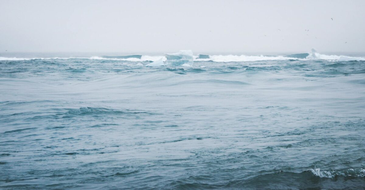 A tranquil ocean scene with icebergs and gentle waves evoking a sense of peace