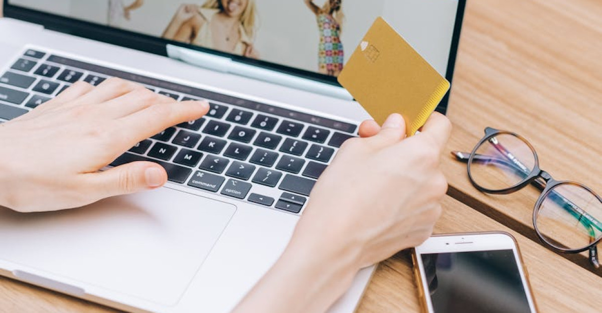 Person shopping online using a laptop and credit card lifestyle technology concept