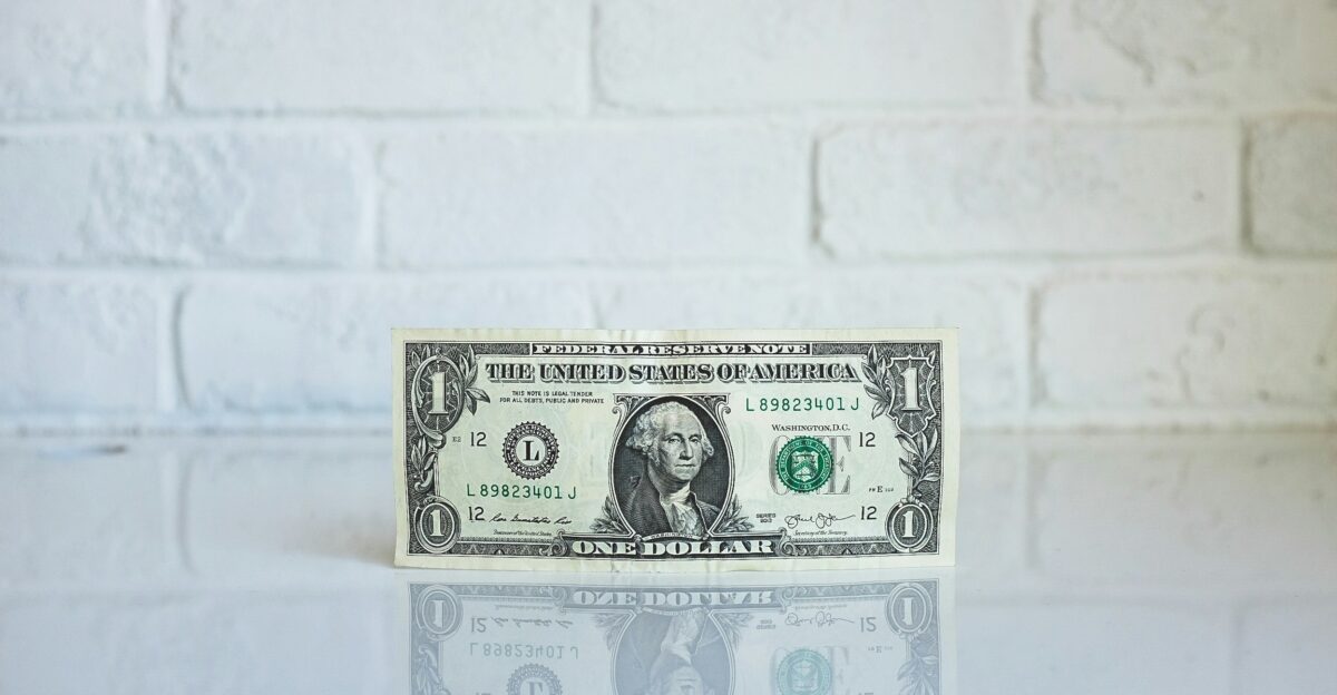 U S dollar banknote on white surface