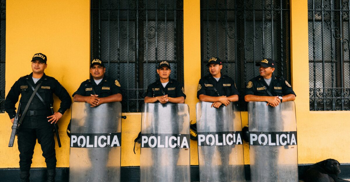 police man holding windshield