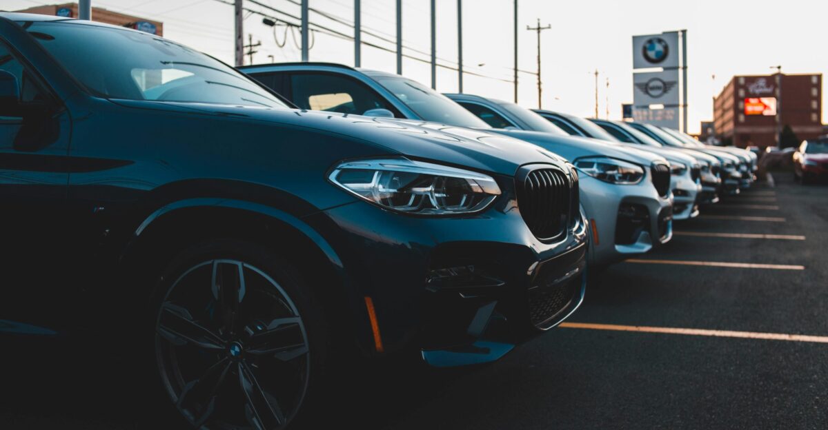 a row of cars parked in a parking lot
