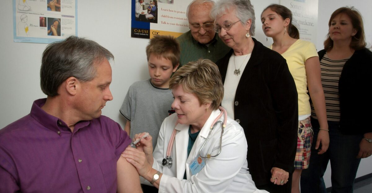 a group of people standing in a room
