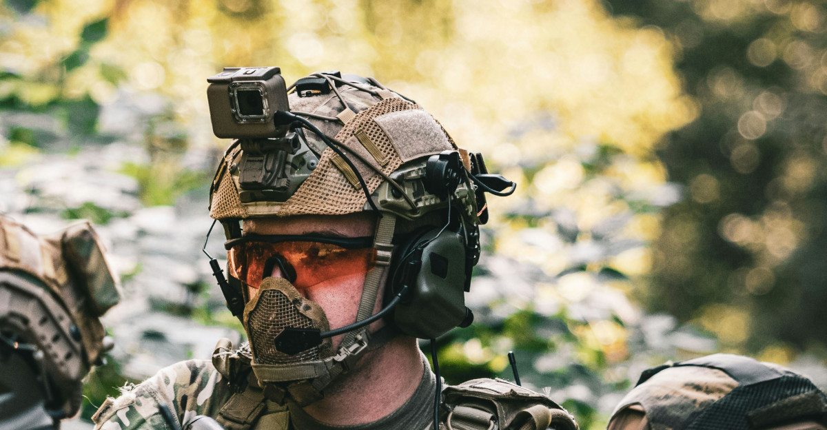 man in black and gray camouflage uniform wearing black helmet and black helmet