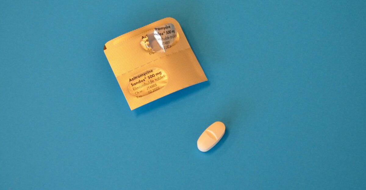 brown and white card on blue surface