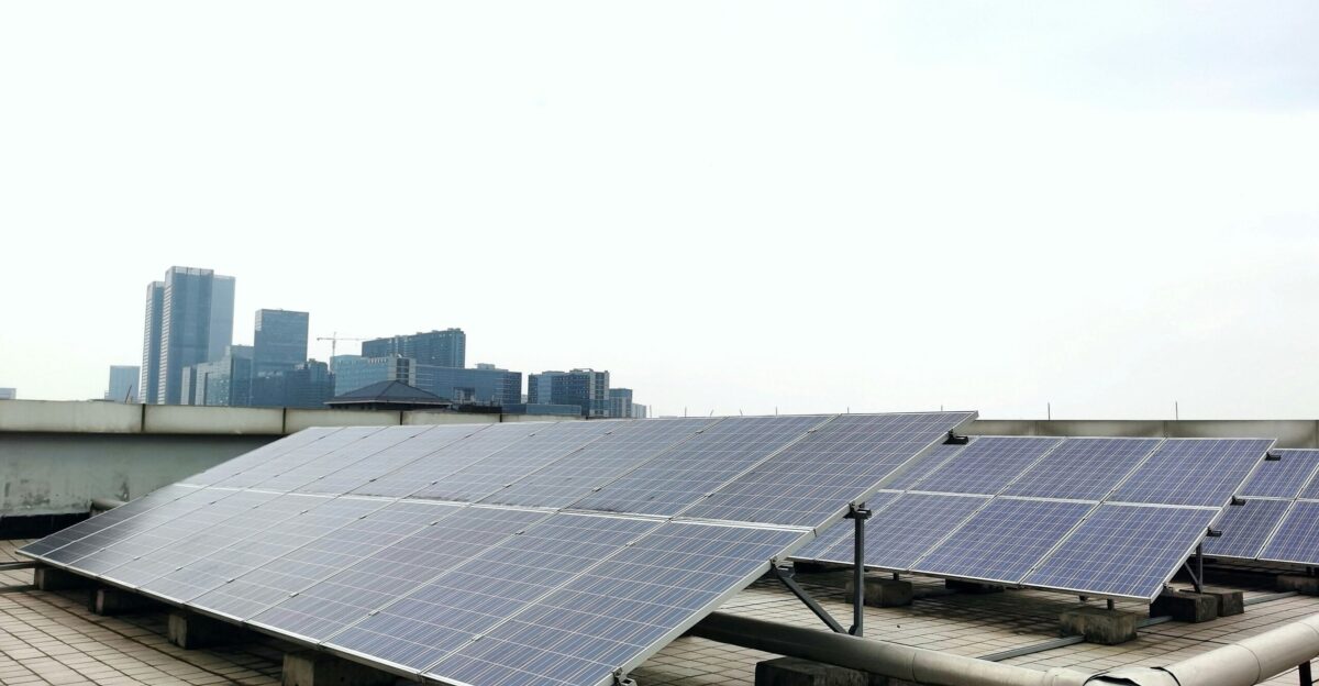 a row of solar panels sitting on top of a roof
