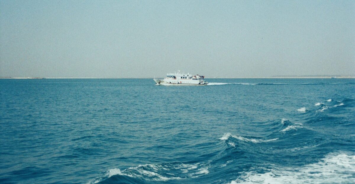 a boat traveling across a large body of water