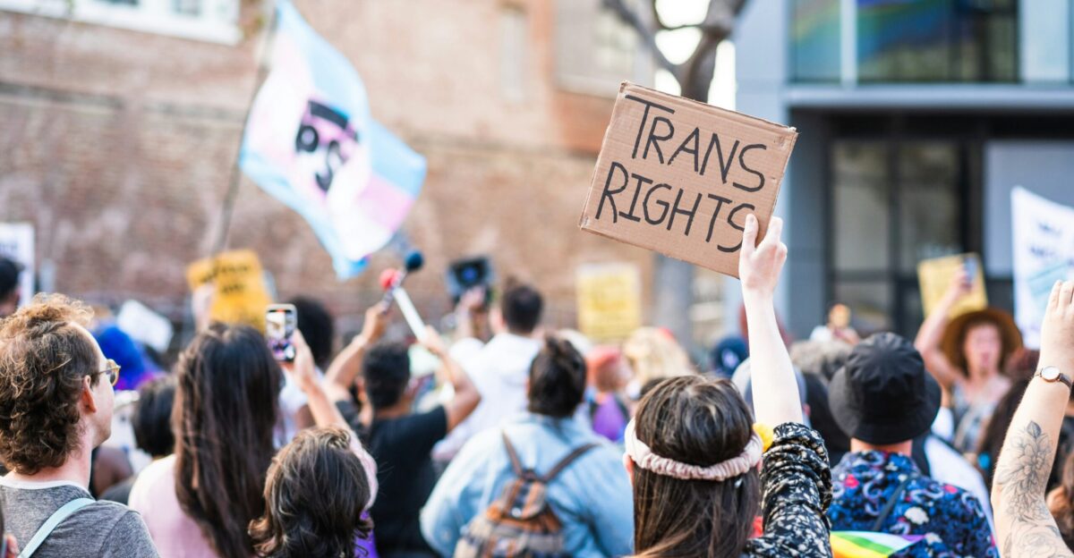 a crowd of people holding signs