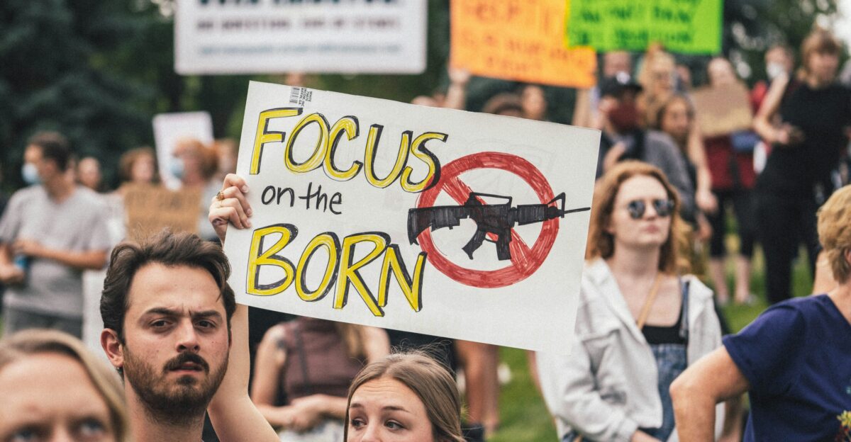 a group of people holding signs