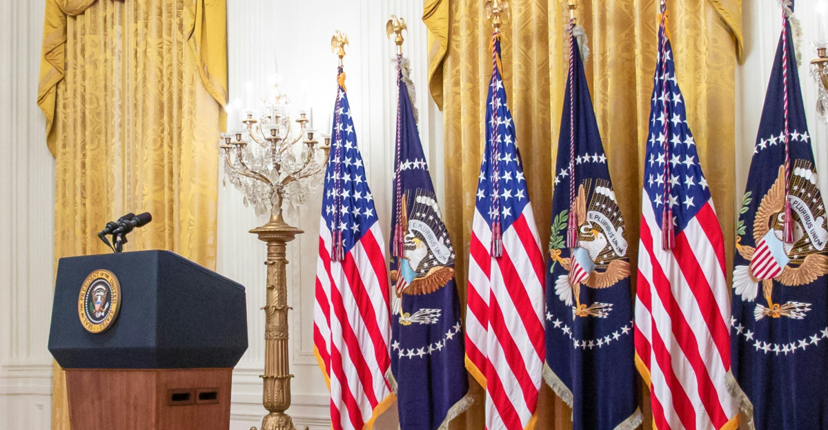 a podium with flags in a room