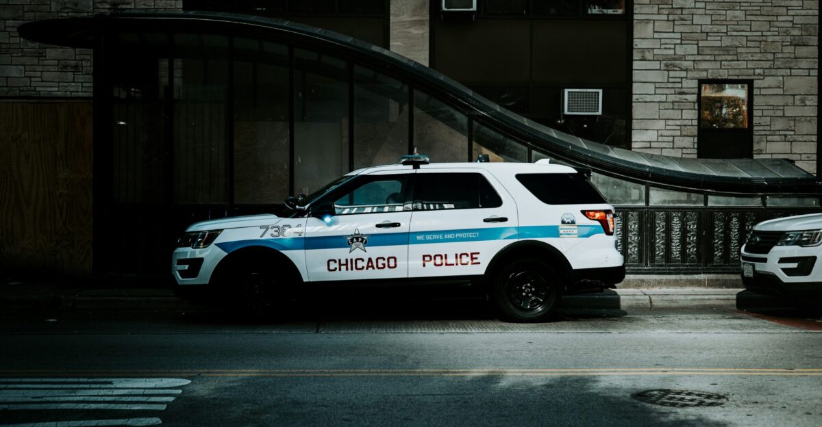 a police car parked in front of a building