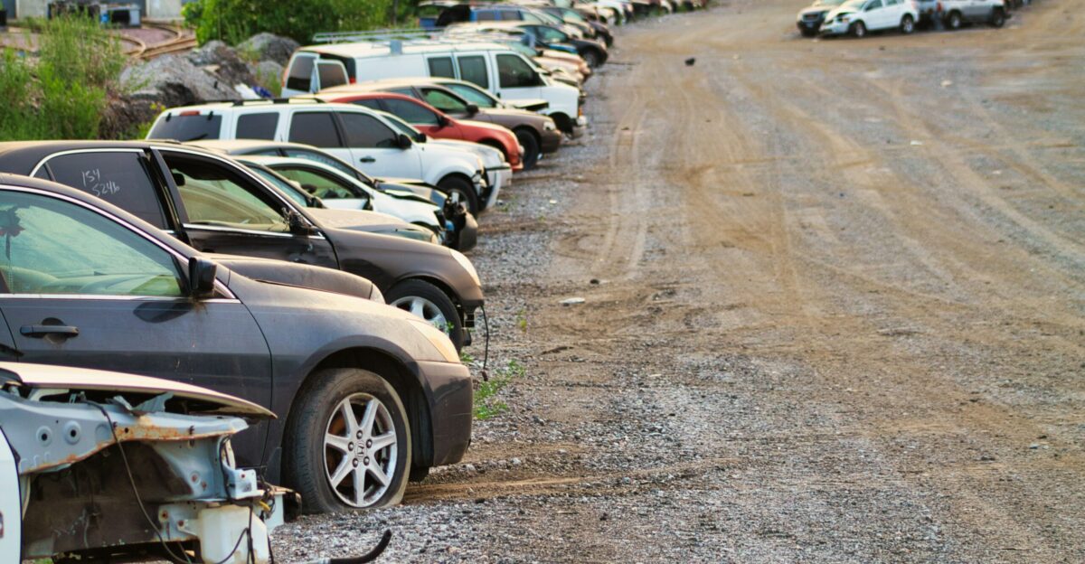 a bunch of cars that are sitting in the dirt