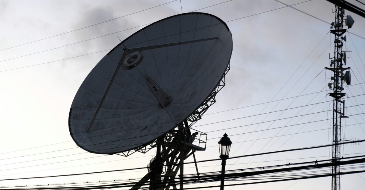 a large satellite dish sitting on top of a building