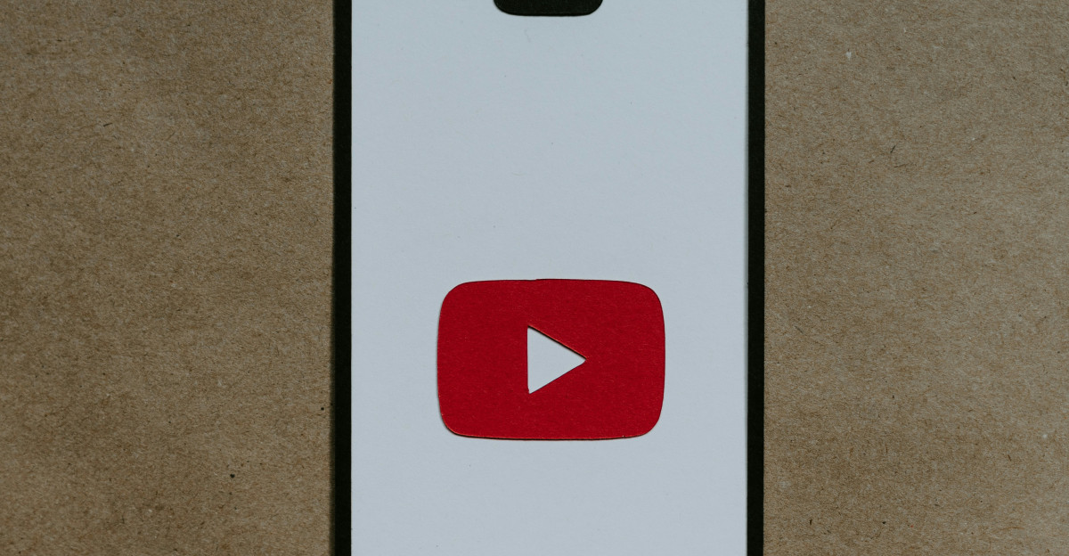a white phone with a red youtube logo on it
