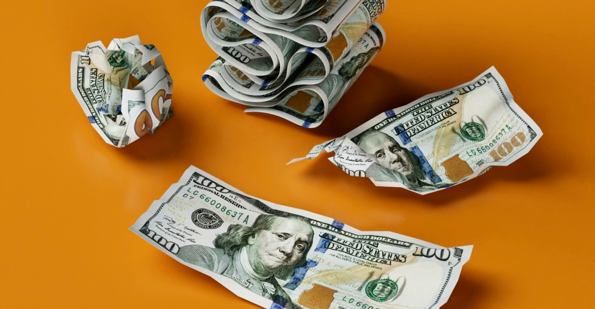 a stack of money sitting on top of a table