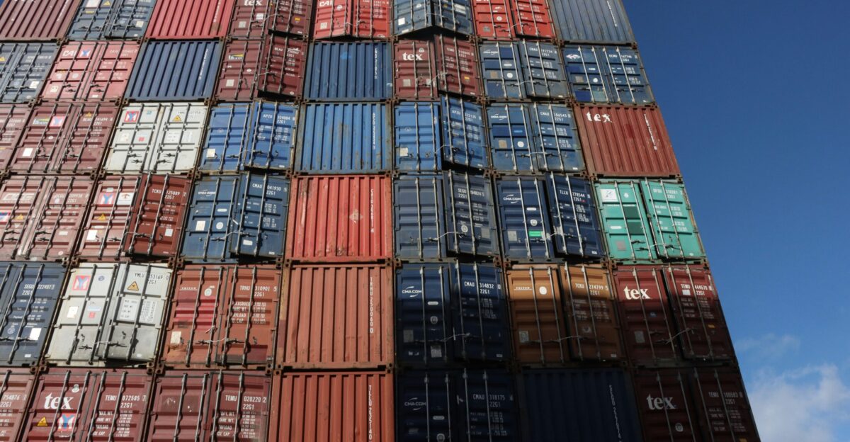 a large stack of cargo containers stacked on top of each other