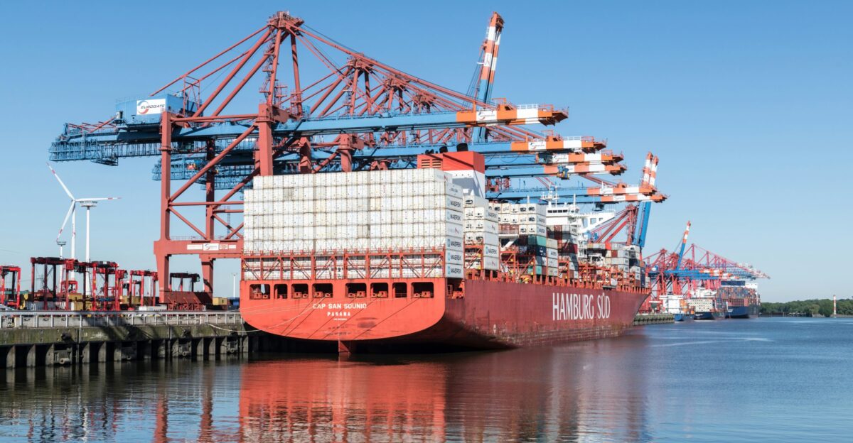 a large cargo ship docked at a dock