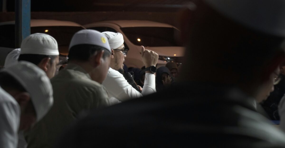 A group of men standing next to each other