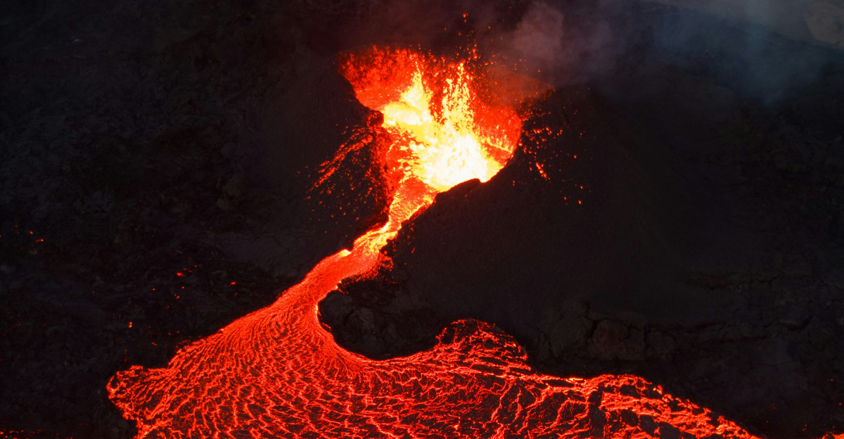 An aerial view of a lava flow at night
