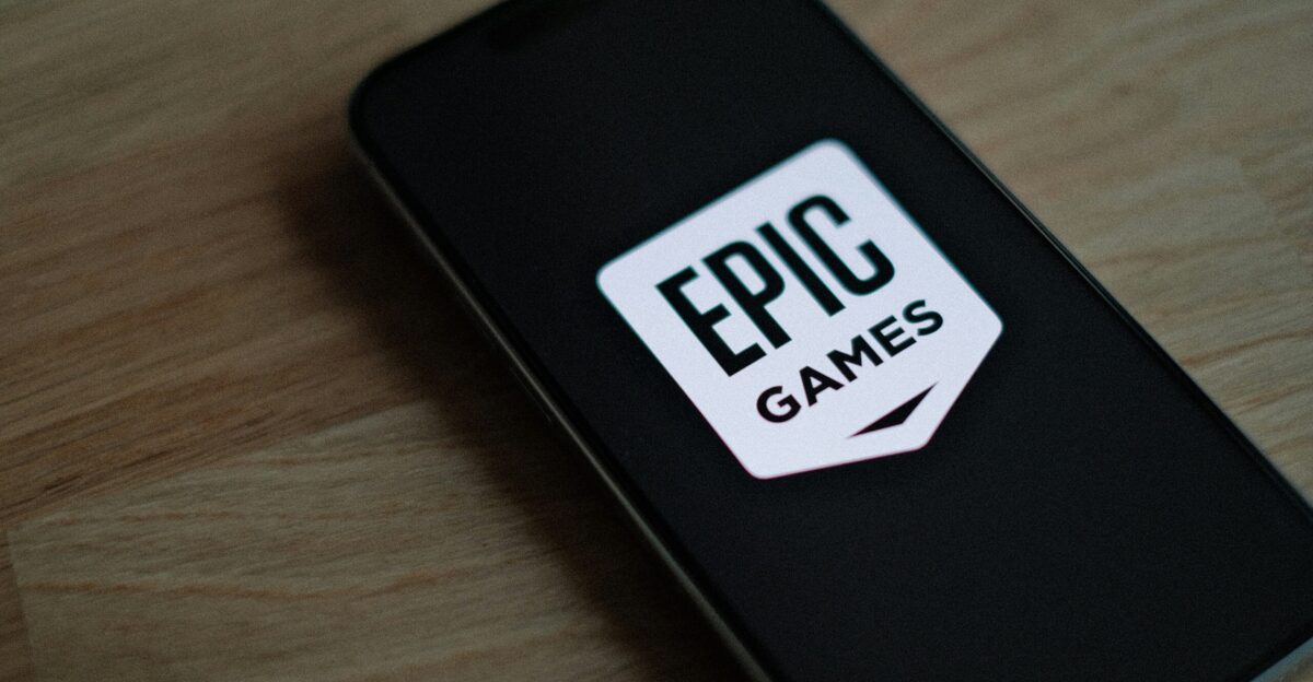 A phone with a sticker on it sitting on a table