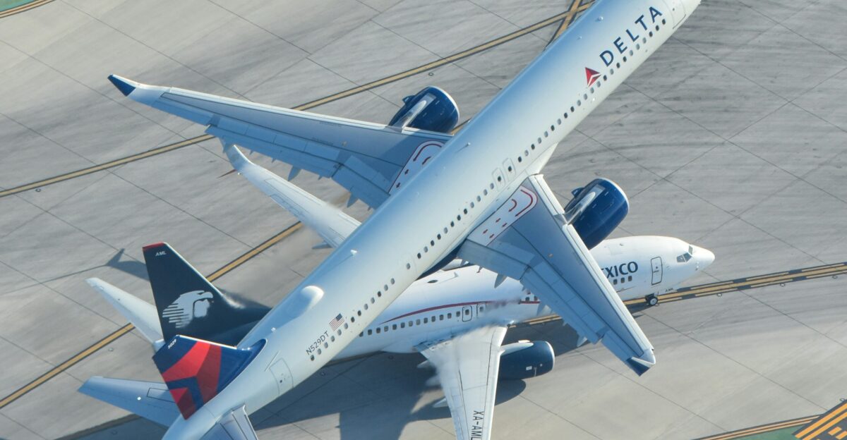 A large jetliner sitting on top of an airport tarmac