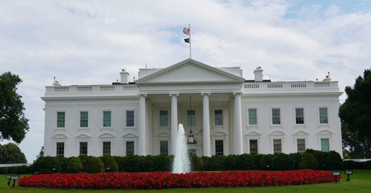 The white house is prominently featured in the image