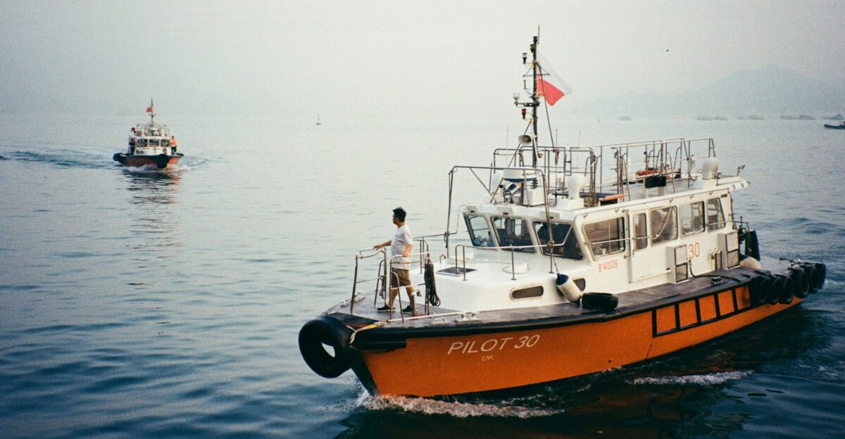 Two pilot boats are sailing on the water