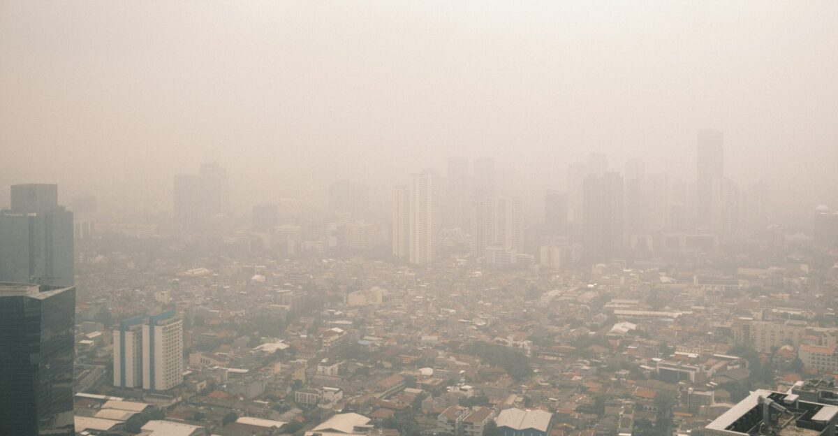 City skyline obscured by thick smog and haze