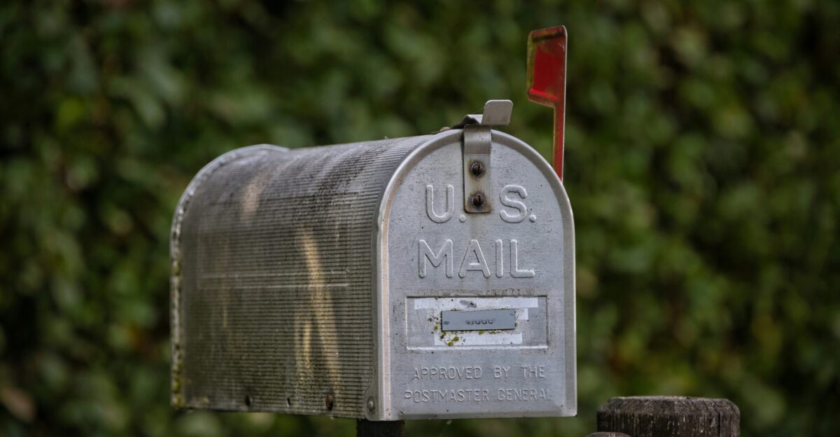 A u s mail mailbox stands outdoors