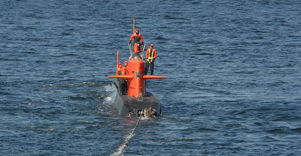 GROTON Conn Feb 12 2007 - Nuclear research submarine NR-1 is towed by Military Sealift Command MSC submarine support vessel MV Carolyn Chouest as the submarine gets underway from Naval Submarine Base New London Conn NR-1 is scheduled to conduct a visual and acoustic survey of the Flower Garden Banks in the Gulf of Mexico U S Navy photo by Mass Communication Specialist 1st Class John Fields RELEASED