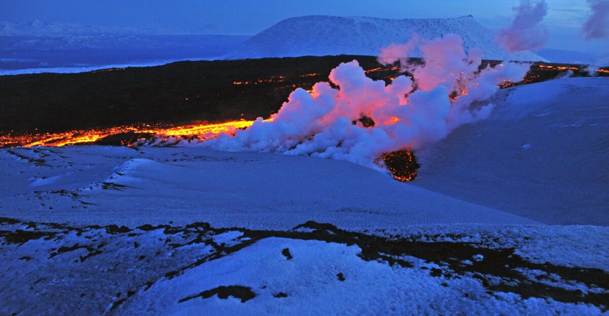 Twilight Russia river of lava melting into snow Tolbachik