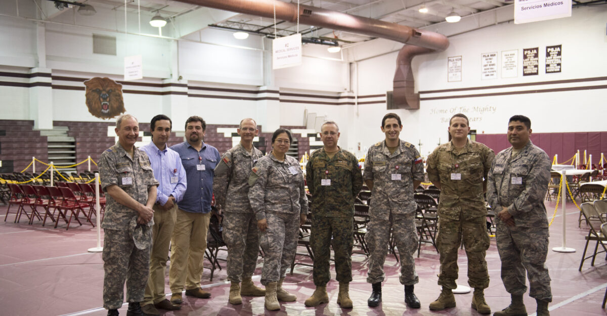 A Chilean military delegation stands with services members from the Texas Military Department following a tour of an Operation Lone Star medical site in Pharr Texas July 27 2016 The Texas Military Department as a part of the State Partnership Program partners with the Chilean military and conducts numerous exchanges each year facilitating cooperation across all aspects of international civil-military affairs and encouraging people-to-people ties at the state level OLS is an annual medical disaster preparedness training exercise uniting federal state and local health and human service providers that addresses the medical needs of thousands of underserved Texas residents every year U S Army National Guard photo by Sgt 1st Class Malcolm McClendon