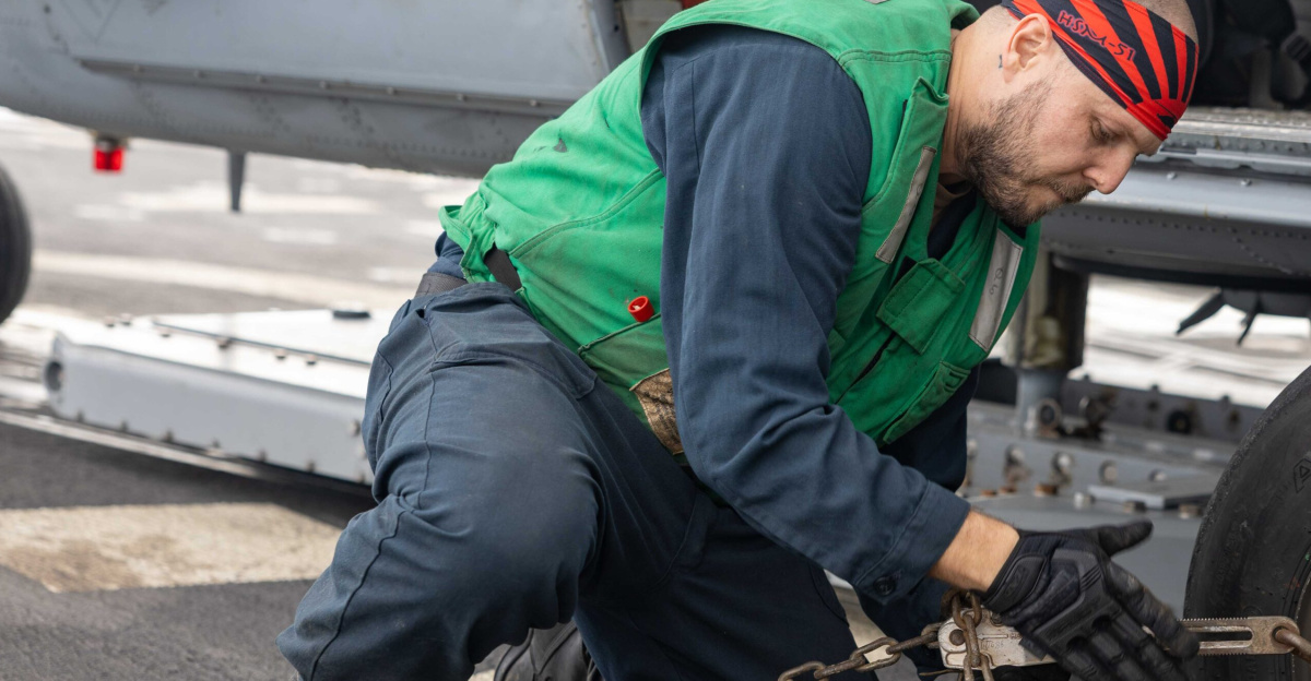 241130-N-KW492-1080 (Nov. 30, 2024) PHILIPPINE SEA
Aviation Machinist's Mate Airman Chase Nicholson, from Orange, California, assigned to Helicopter Maritime Strike Squadron (HSM) 51, secures an MH-60R Sea Hawk with a chain on the flight deck of the Arleigh Burke-class guided-missile destroyer USS Preble (DDG 88) in the Philippine Sea, Nov. 30. Preble is forward-deployed and assigned to Destroyer Squadron (DESRON) 15, the Navy's largest DESRON and the U.S. 7th Fleet's principal surface force. (U.S. Navy photo by Mass Communication Specialist 1st Class Ryre Arciaga)