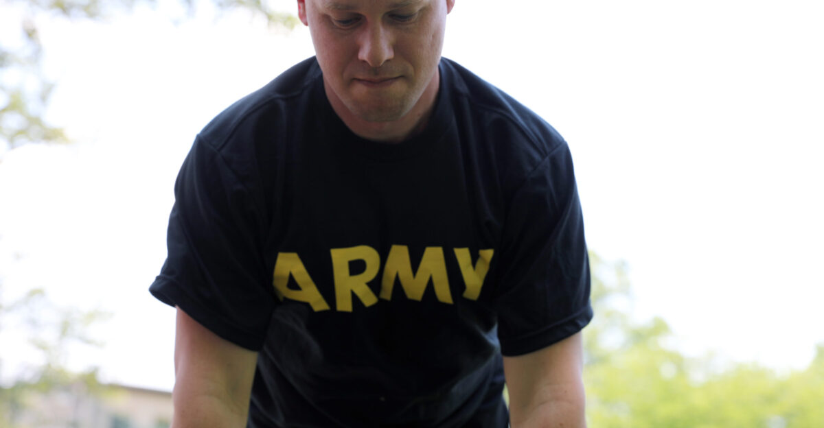 Maj Jared Black the chief of managed care for Regional Health Command Europe completes hand-release push-ups during the Army Combat Fitness Test