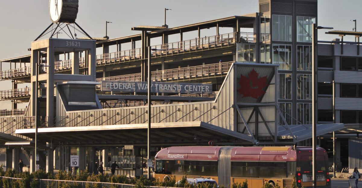 View of the platform and garage at Federal Way Transit Center with a King County Metro RapidRide bus in the foreground