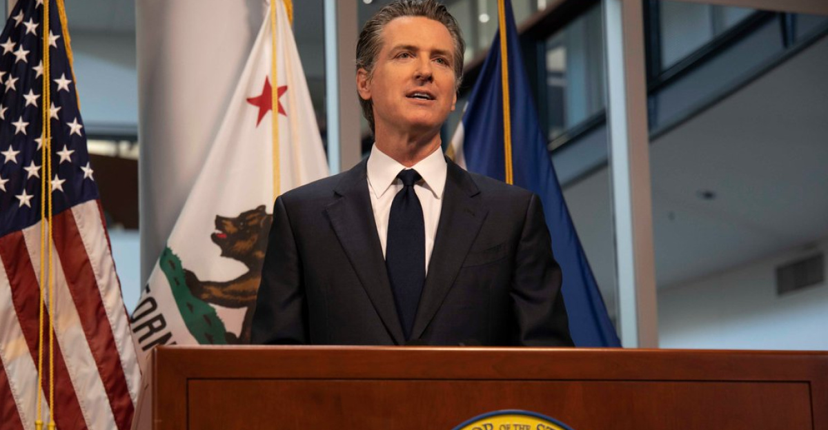 Gavin Newsom speaking at a podium.