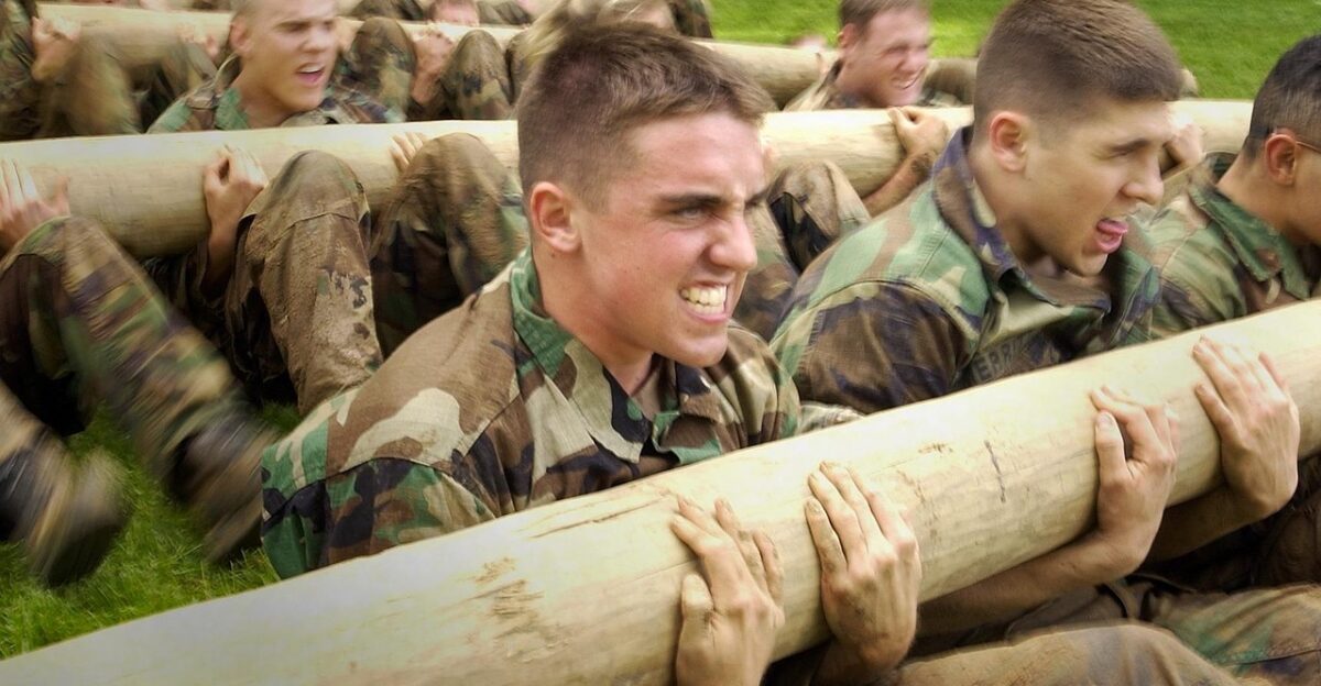 us naval academy annapolis maryland trainees lifting exercising workout strenuous exertion heavy log timber outside military navy brown fitness brown exercise brown workout lifting exertion military military navy navy navy navy navy