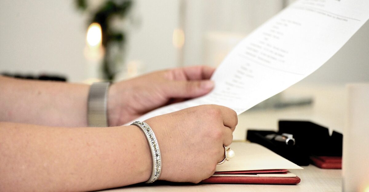 hands read document read out registry office nature official contract leaf desk