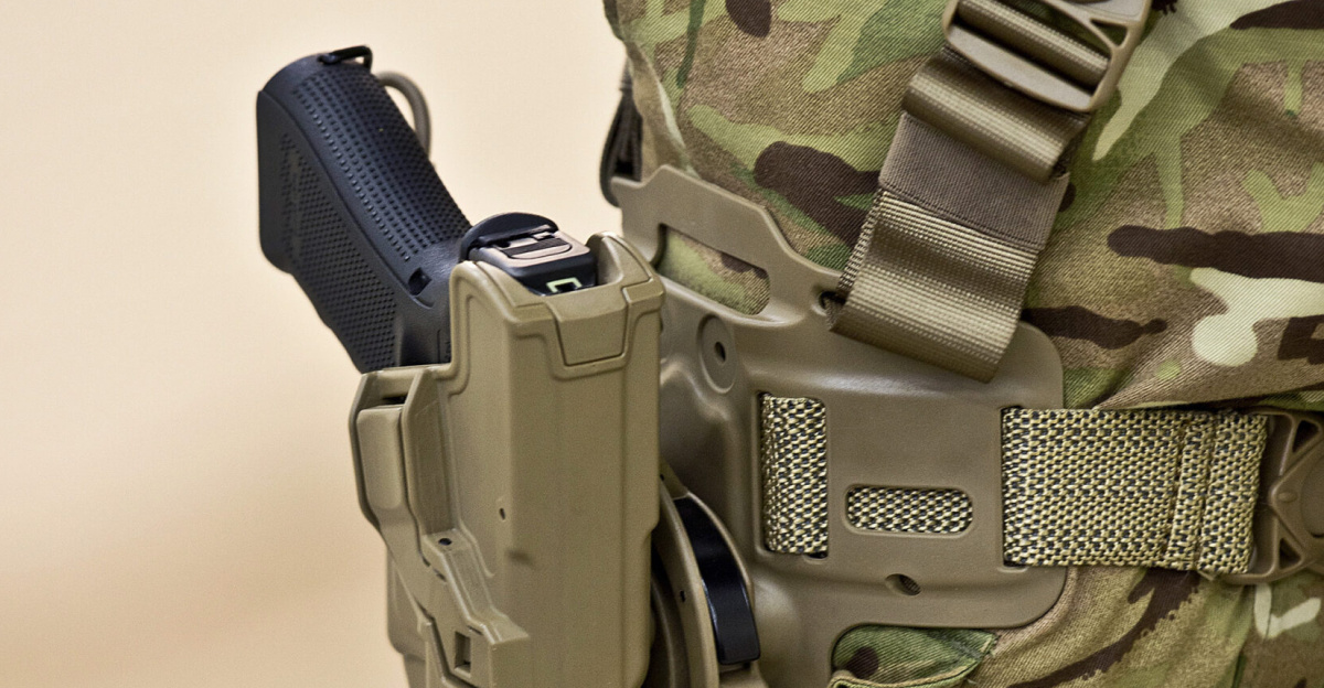 Soldier wearing a holster holding a Glock 17 handgun.
<p>The MOD has signed a £9m contract to provide the Armed Forces with more than 25,000 new Glock sidearms. The Glock 17 Gen 4 pistol is much lighter than the current Browning pistol, and more accurate.
</p><p>The Glock 17 also has an increased magazine capacity of 17 9mm rounds, compared to 13 rounds for the Browning.
</p><p>Personnel across all three Services will begin to receive the new Glock 17s in the coming weeks and troops deployed to Afghanistan will be among the first to use the new weapon. The contract with Viking Arms Ltd of Harrogate, Yorkshire, also includes more than 25,000 holsters.
</p>
<ul><li>Object Name: Emb_DES-2013-003-0184</li>
<li>Organization: MOD</li>
<li>Supplemental Categories: Equipment, Weapons, Guns, Pistol</li>
<li>Keywords: Army, Equipment, Weapon, Gun, Firearm, Small Arms, Sidearm, Handgun, Pistol, Glock, 17, Holster</li>
<li>Country: England</li></ul>