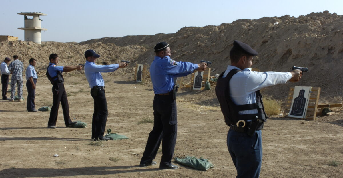 Iraqi Police fire Glock 9mm handguns on the Bagara range held on Forward Operating Base McHenry on Oct 8 A total of 278 Iraqi Police Officers which included 16 officers fired on this range supported by the 3rd Platoon 218th Military Police Company