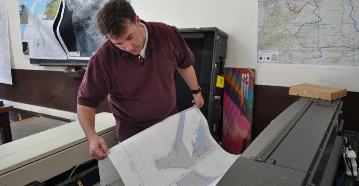 Jason Davis an analyst with the Geospatial-Intelligence Agency NGA prints a map of Morocco for African Lion 2012 in Agadir Morocco April 15 2012 NGA analysts deployed from the agency s office in Stuttgart Germany to create maps for exercises across Africa African Lion is an annually scheduled joint combined U S -Moroccan exercise sponsored by U S Africa Command and designed to promote interoperability and mutual understanding of each nation s military tactics techniques and procedures