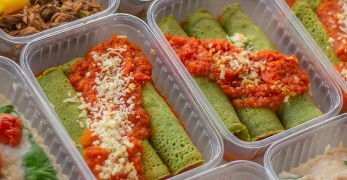 An assortment of healthy colorful meal prep boxes featuring vegetables grains and proteins
