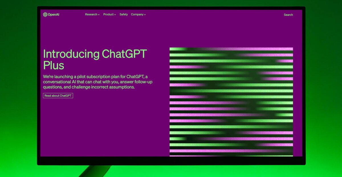 Close-up of a monitor displaying ChatGPT Plus introduction on a green background