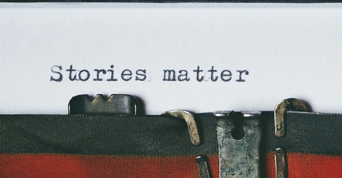 Close-up of a vintage typewriter with the text 'Stories matter' typed on paper, evoking nostalgia.