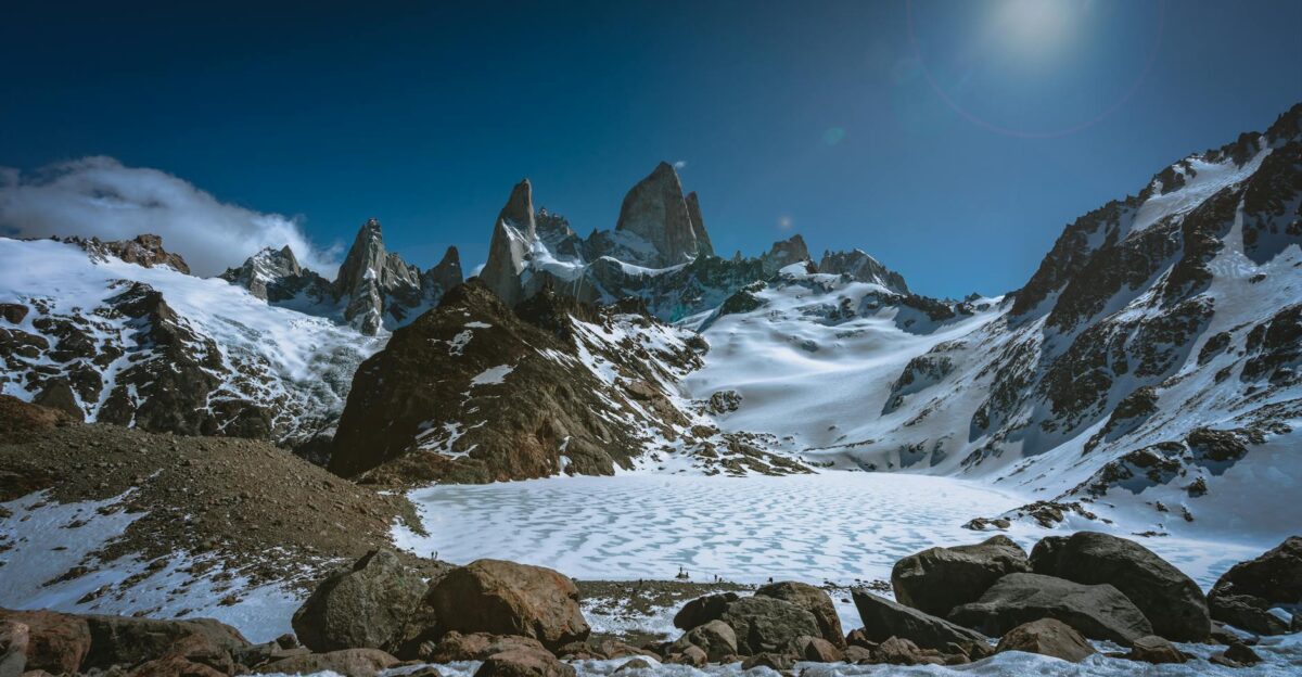 Majestic snow-covered mountains and rugged terrain in El Chalt n Argentina under a clear winter sky