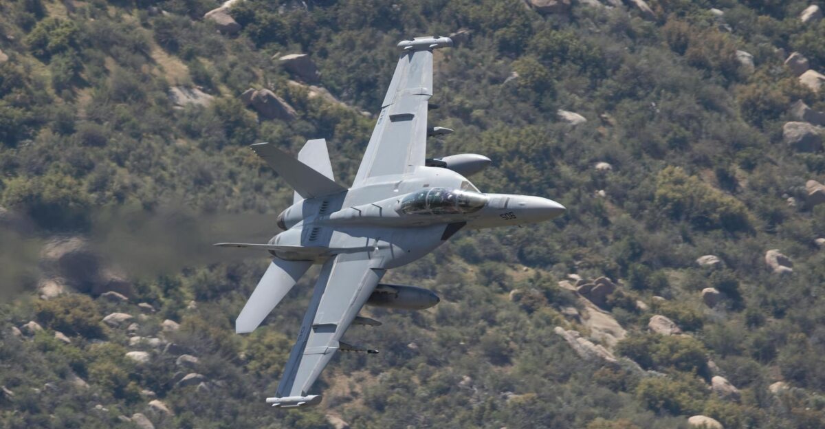 F A-18 Super Hornet flying over rugged terrain in Kernville California