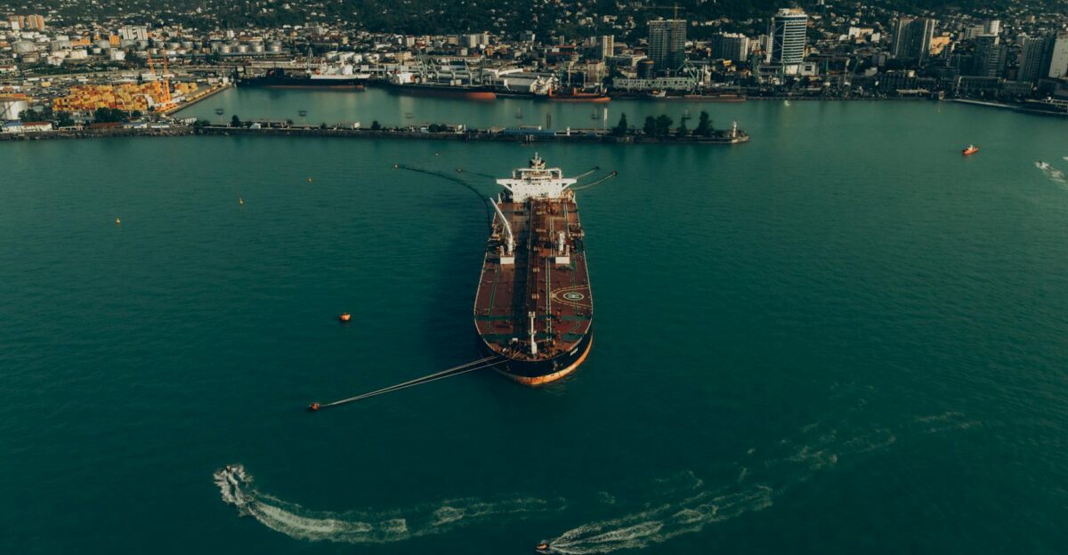 Scenic aerial view of Batumi Port in Georgia showcasing a cargo ship docking with the city skyline in the background