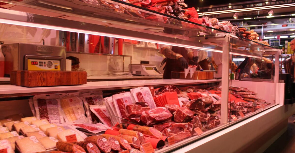 Fresh meat selection in a Barcelona market deli vibrant display and diverse cuts