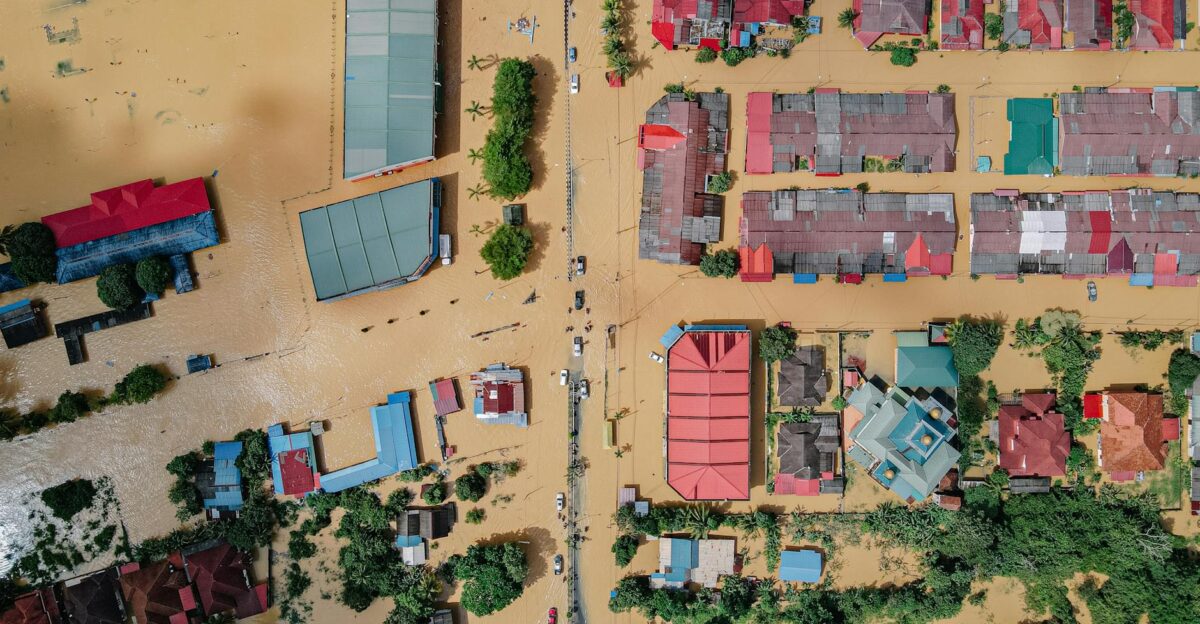 Aerial view of a flooded town showcasing buildings and streets submerged in water